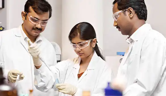 three scientists in laboratory