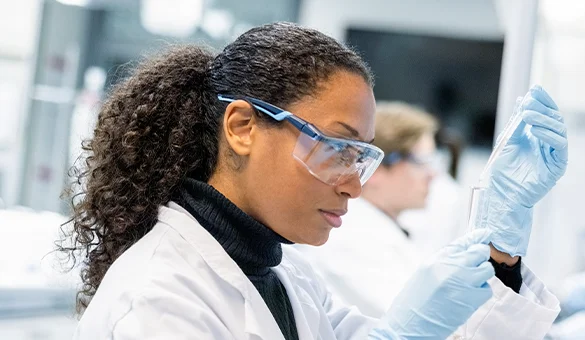 lady in lab with PPE