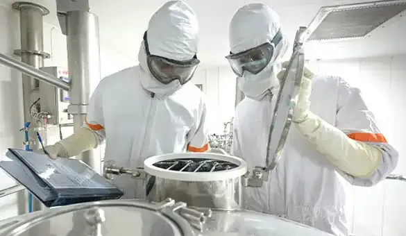 men in PPE pharma